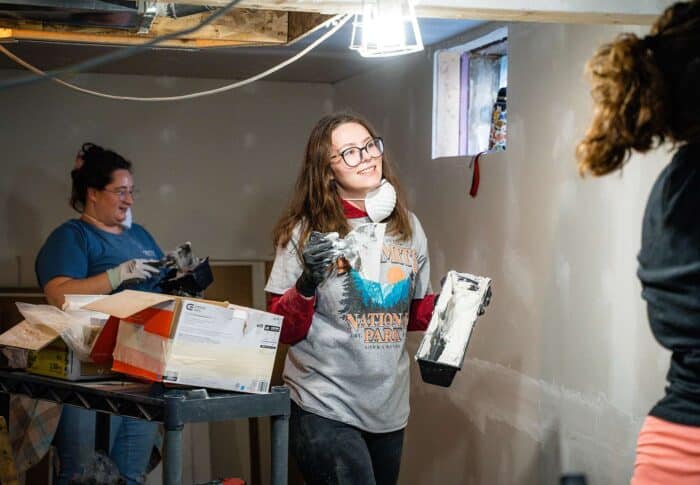 volunteers doing drywall mudding